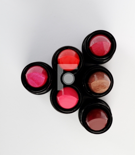 6 colorful lipsticks top view 