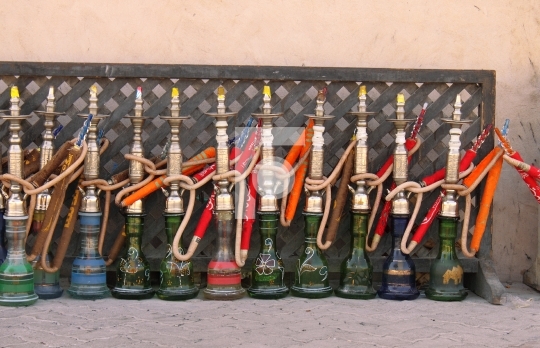 arabic smoking pipes in a row - hookah / sheesha
