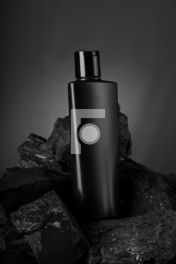 Black Blank Product Bottle on Black Stone for Mockups