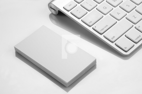 Blank Business Card Mockup with a Keyboard on White Background