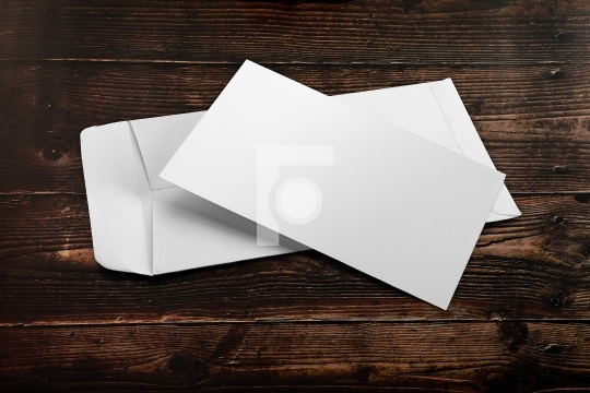 Blank White Envelope Mockup with an Invitation Card on Wooden Ba
