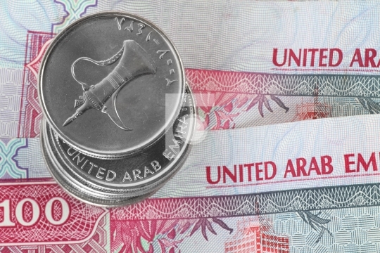 Closeup of dirham coins on notes