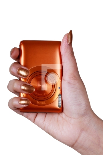 Compact Digital Camera in a Female_qt_s Hand