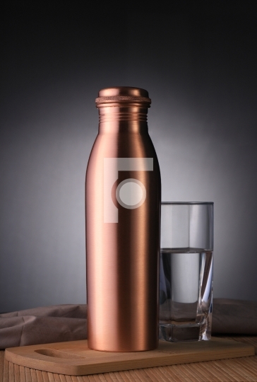 Copper Water Bottle and Glass of Water for Environment Friendly 