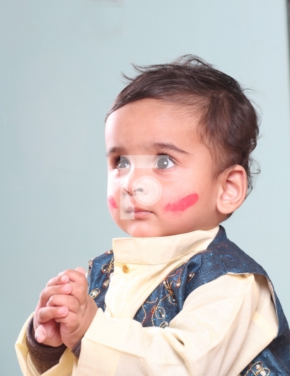Cute Indian Baby Boy Celebrating Holi with Colour on Face