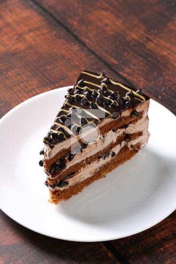 Dessert - A Sweet Cake Slice with Chocolate Chips and Cream