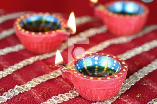 Diwali Diya with blurred lights in the background
