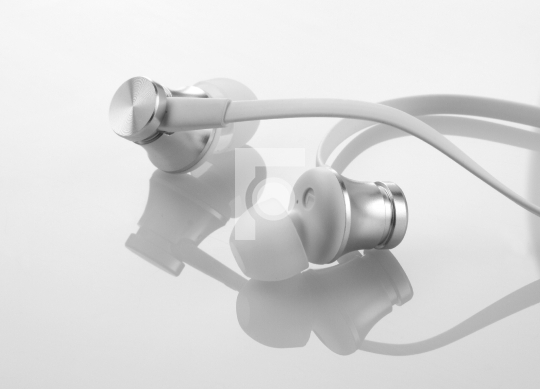 Earphones Headphones on Reflective White Background