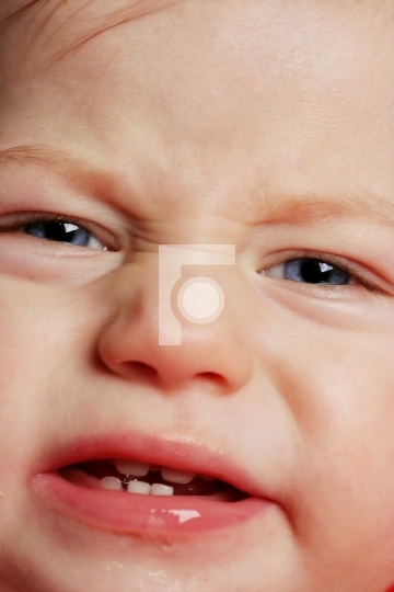face closeup of a crying baby