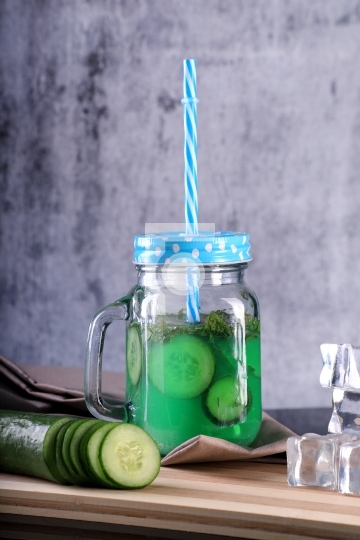 Fresh Cucumber Juice in a Mason Jar with ice cubes