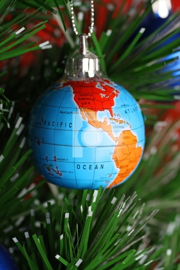 Globe as onament on christmas tree, christmas concept