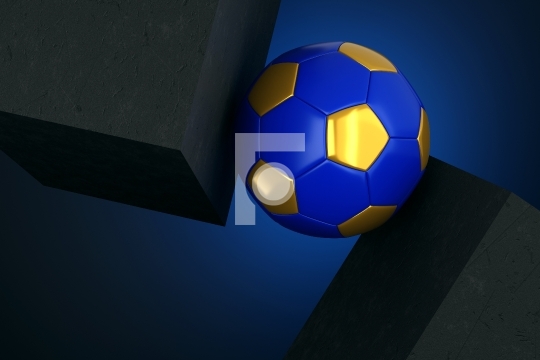 Golden and Blue Football Soccer Ball between 2 Solid Concrete Bl