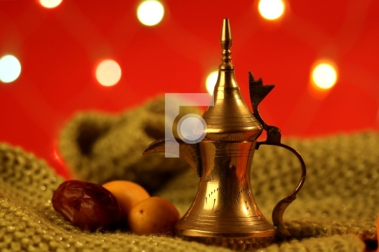 golden arabic tea pot with dates