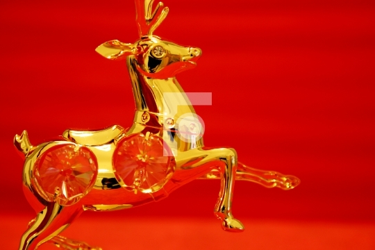 golden reindeer in red background