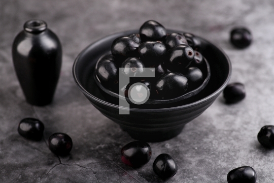 Indian Black Berry or Jamun Fruit, Java Plum in a Black Bowl - H