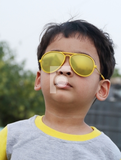 Indian Boy Looking Up Sun glasses Royalty Free Photo