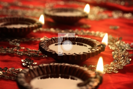 Indian Diwali Diya with Festive Lights and Bokeh