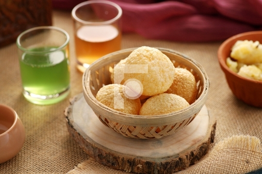 Indian Food Snacks Gol Gappe or Pani Puri or Puchka in a Wooden 