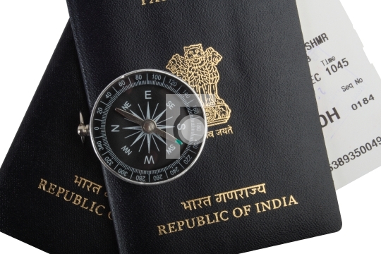 Indian passports, magnetic compass, boarding pass