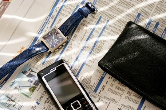 mobile, wallet and wrist watch
