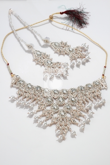 Modern Intricate Indian Jewelry Diamond Necklace Set on White Ba