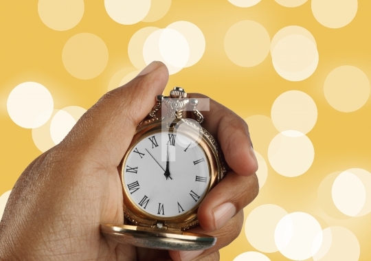 New Year Countdown Concept Golden Antique Watch in a Hand