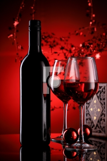 Red Wine Bottle and Glasses with Festive Holiday Feel