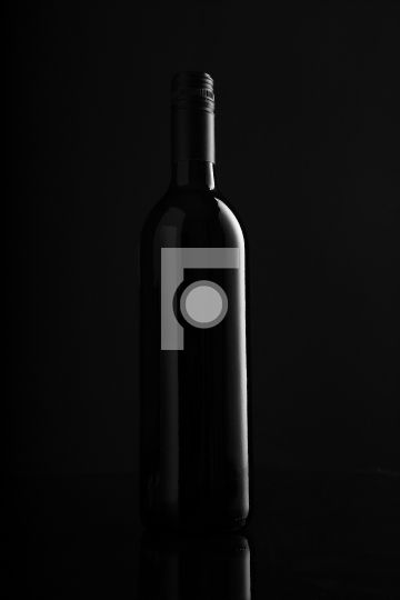 Red Wine Bottle on Black Background