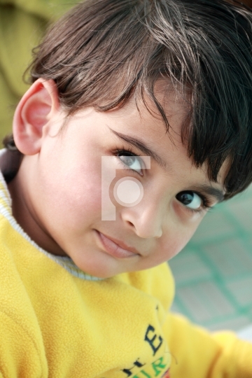Smiling Asian Indian Boy in Yellow Clothes