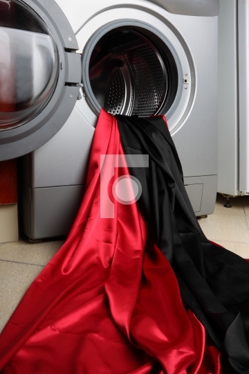Smooth red and black satin fabric in a washing machine