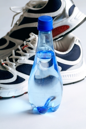 sports shoes and water bottle