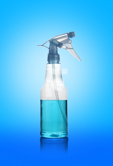 Transparent Spray Water Cleaner Bottle on Blue Background