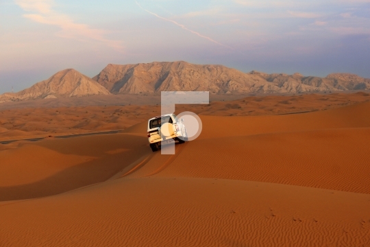 Vehicle in the desert, dubai, united arab emirates