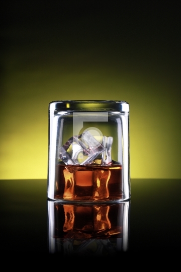 Whisky Glass Upside Down with Ice Cubes