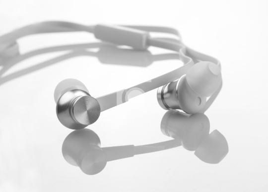 White Color Earphones / Headphones Detail Closeup