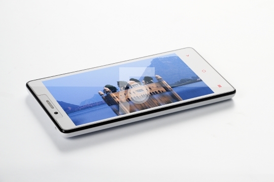 White Colour Mobile SmartPhone with Palace photo on Screen