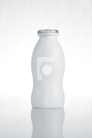 White Plastic Milk Bottle on White Background with Reflection