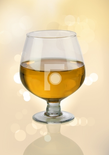 White Wine Glass with Blurred Lights Bokeh Background