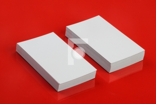 Blank White Business Card for Mockup on Red