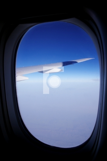 blue sky and aeroplane window - vacation concept