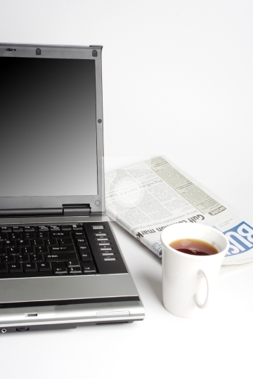 Laptop, Coffee and newspaper